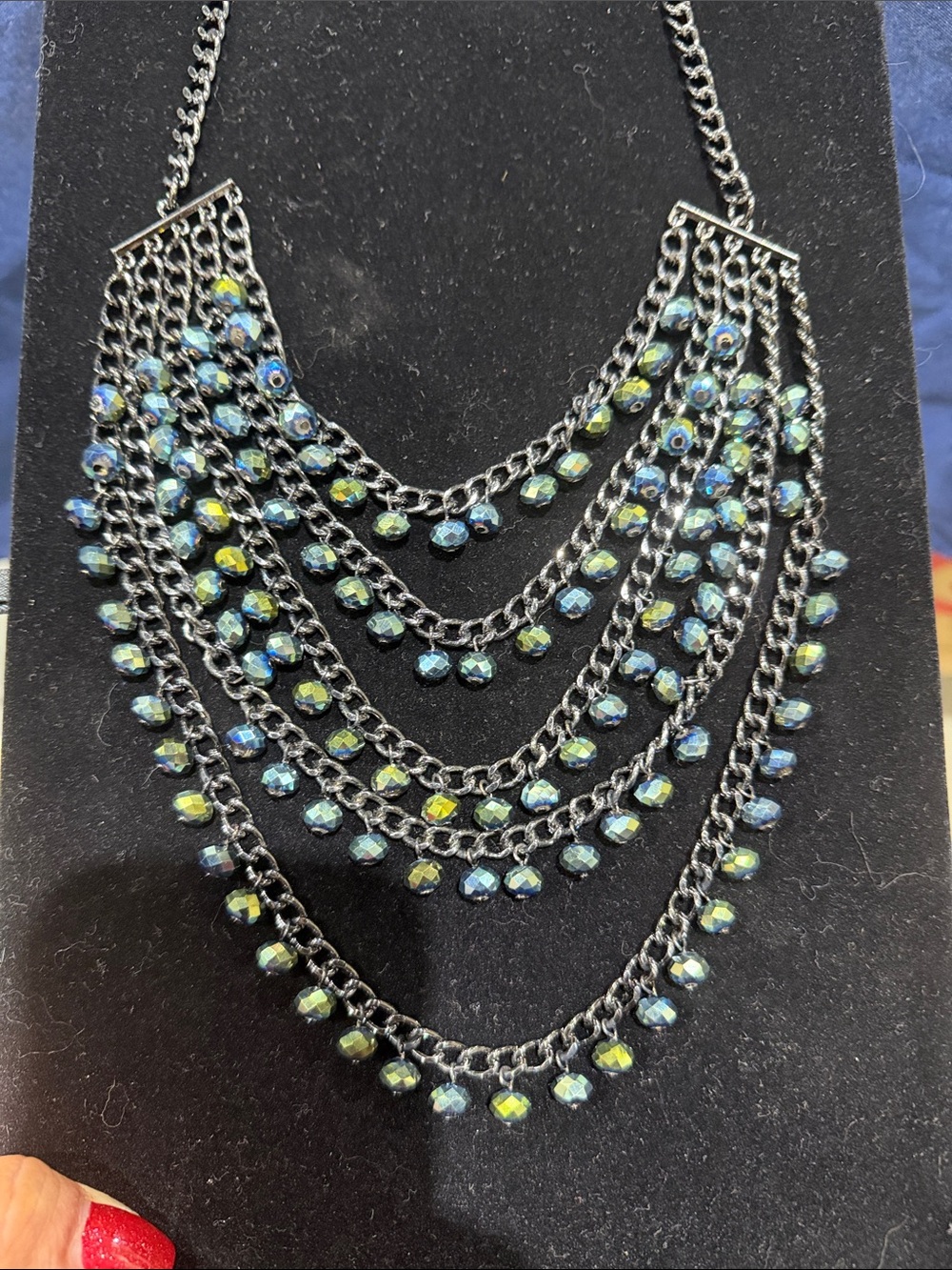 Multi-Strand Iridescent Blue-Green Beaded Statement Necklace on black metal